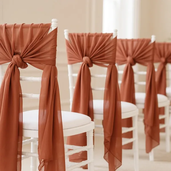 Terracotta chair sashes styled for a wedding table